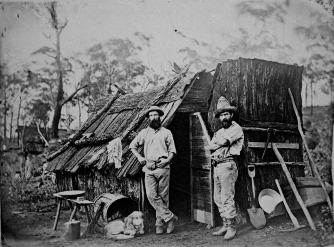 Gold_miners_outside_a_bark_hut_Queensland_ca._1870_7464840500-680x503.jpg